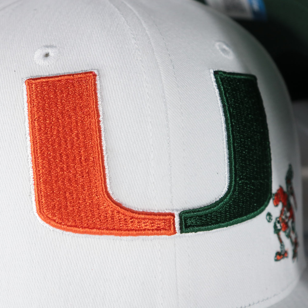 hurricanes logo on the Miami Hurricanes NCAA All in Pro Green Bottom | White Snapback Hat