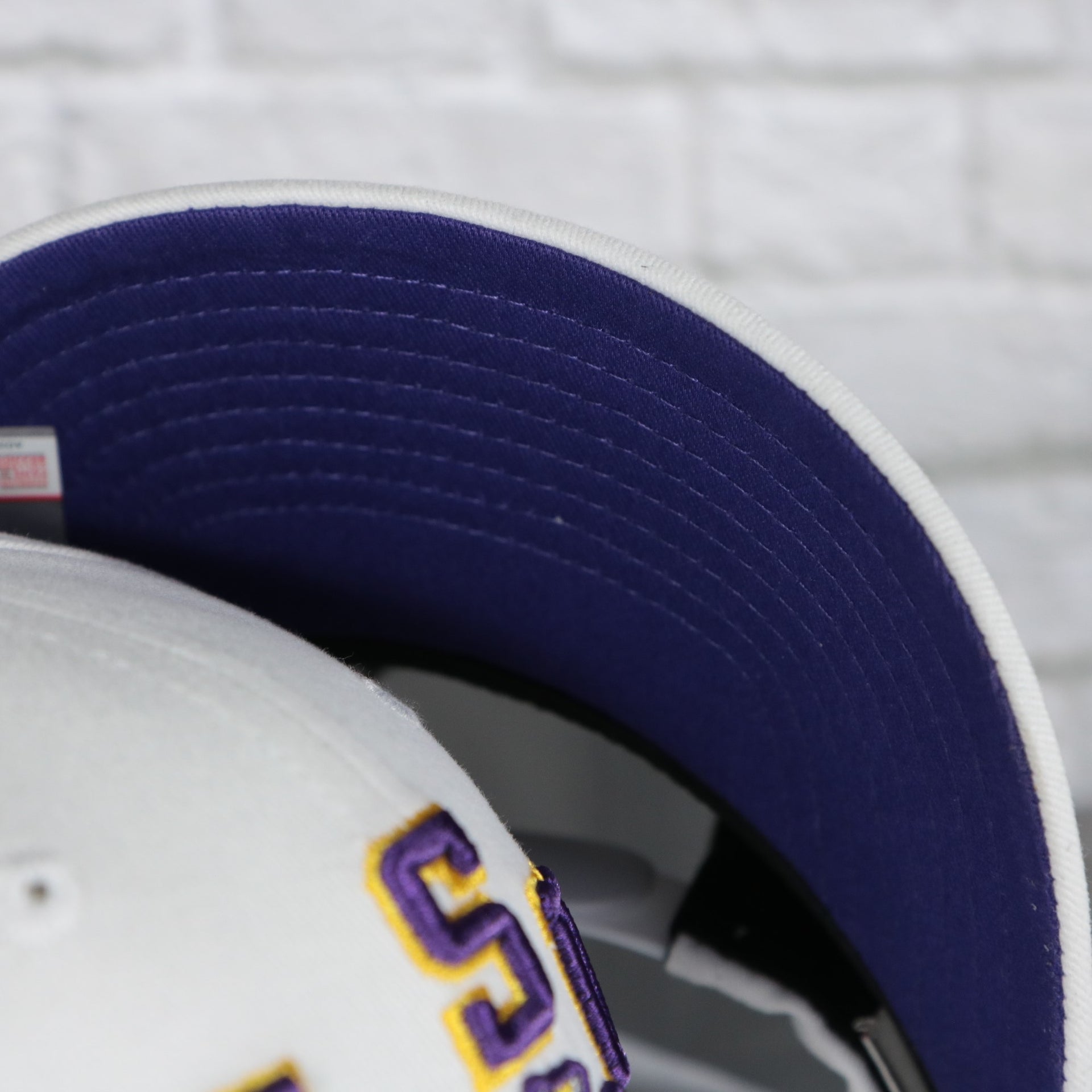 purple under visor on the Louisiana State University Tigers NCAA All in Pro Purple Bottom | White Snapback Hat