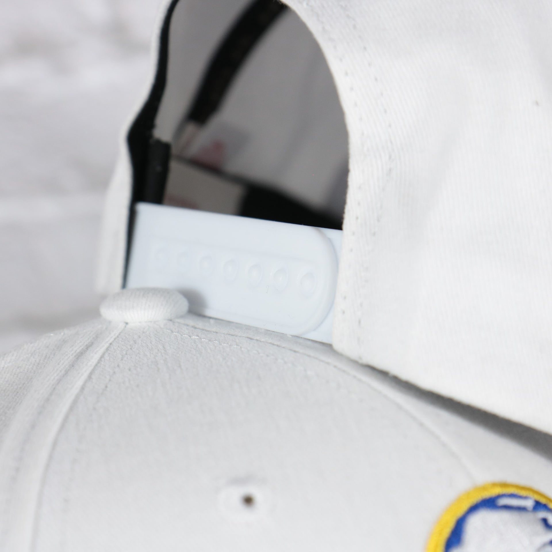 white adjustable snap on the Buffalo Sabres NHL All in Pro Blue Bottom | White Snapback Hat