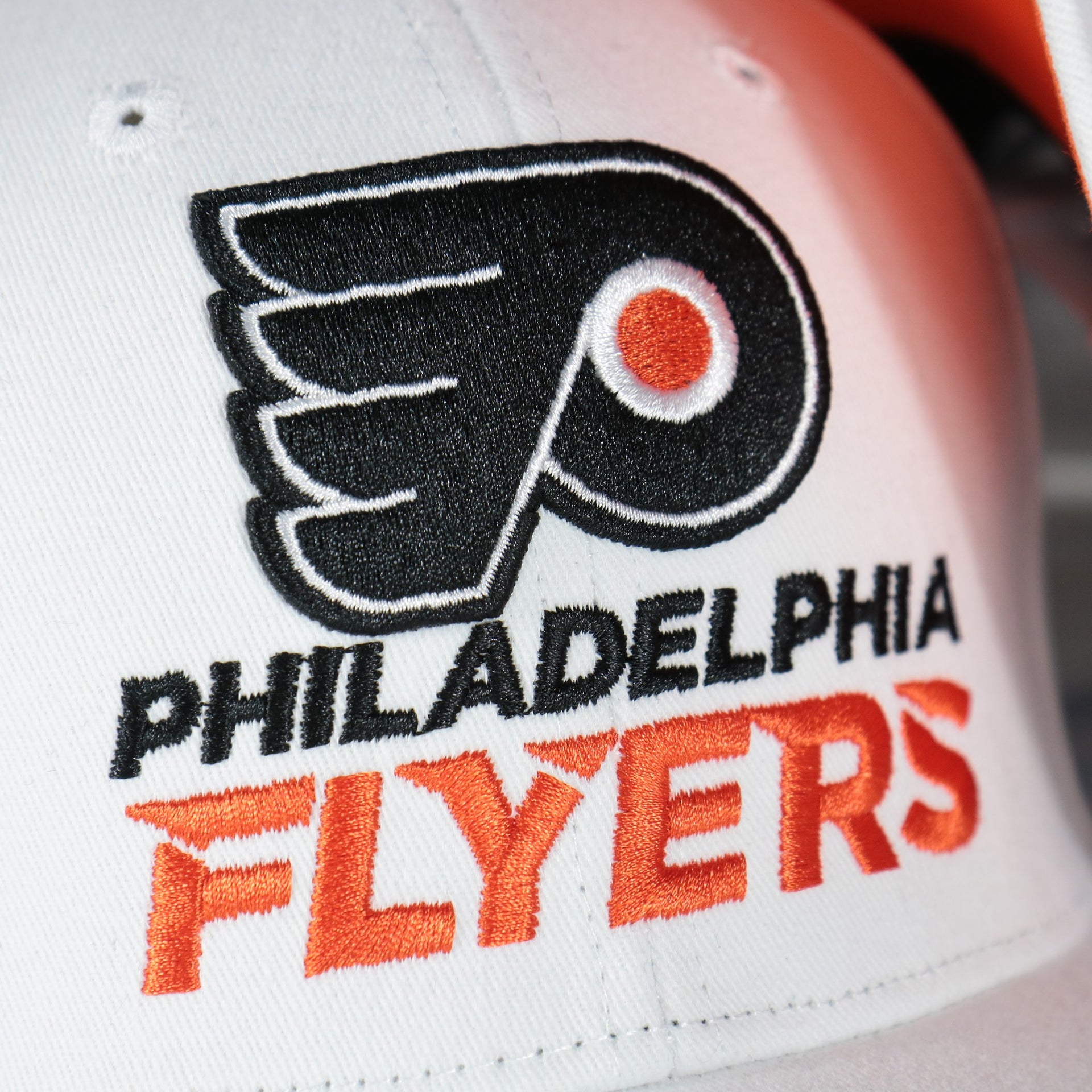 flyers logo on the Philadelphia Flyers NHL All in Pro Orange Bottom | White Snapback Hat