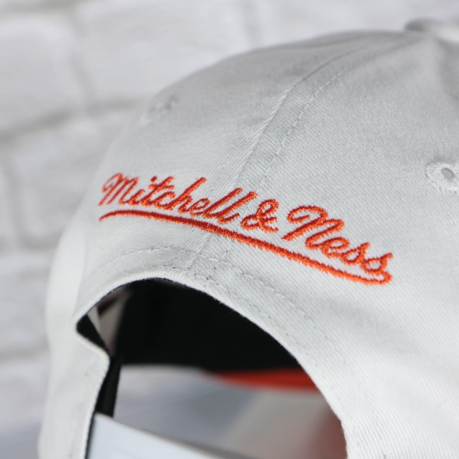 mitchell and ness logo on the Philadelphia Flyers NHL All in Pro Orange Bottom | White Snapback Hat