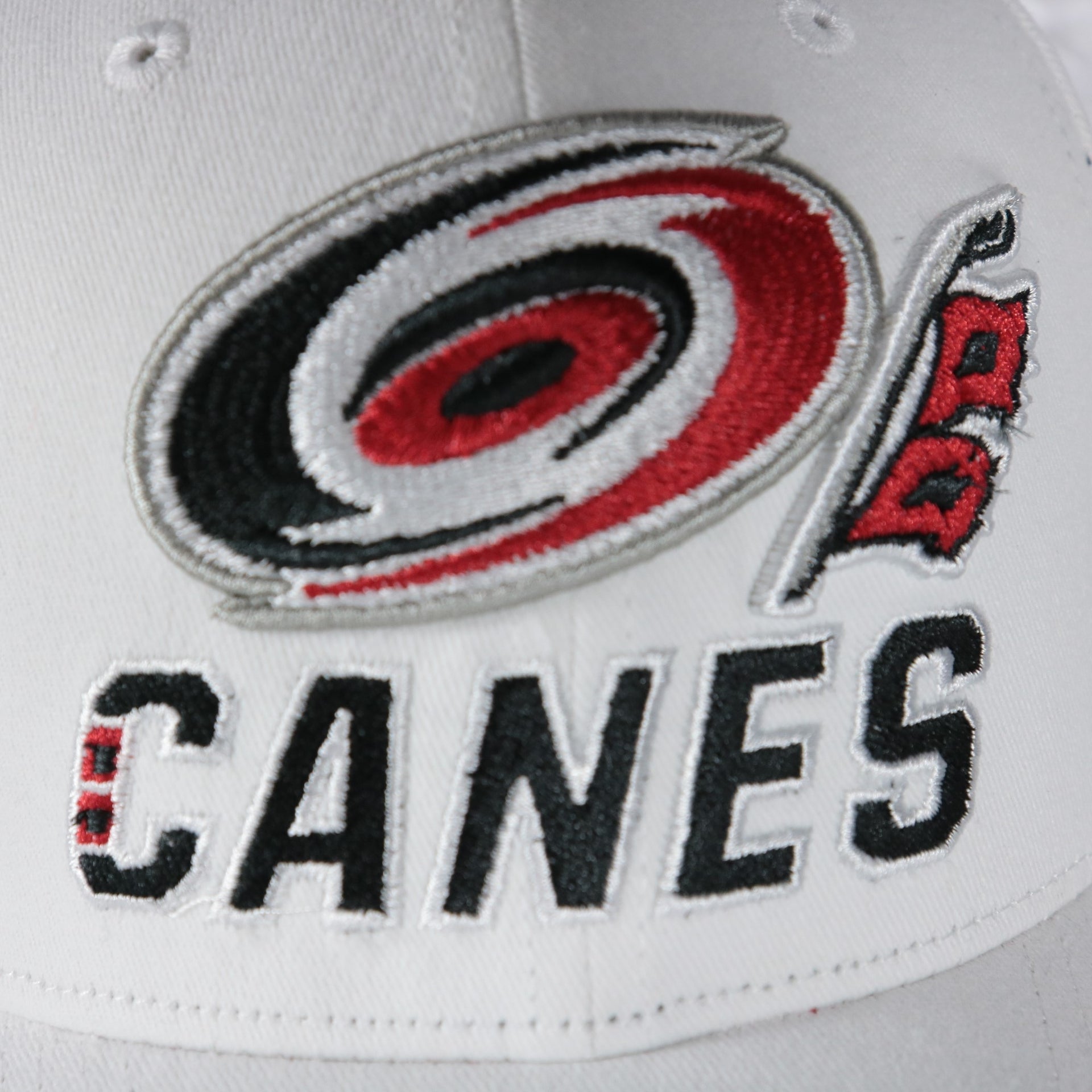 canes logo on the Carolina Hurricanes NHL All in Pro Red Bottom | White Snapback Hat
