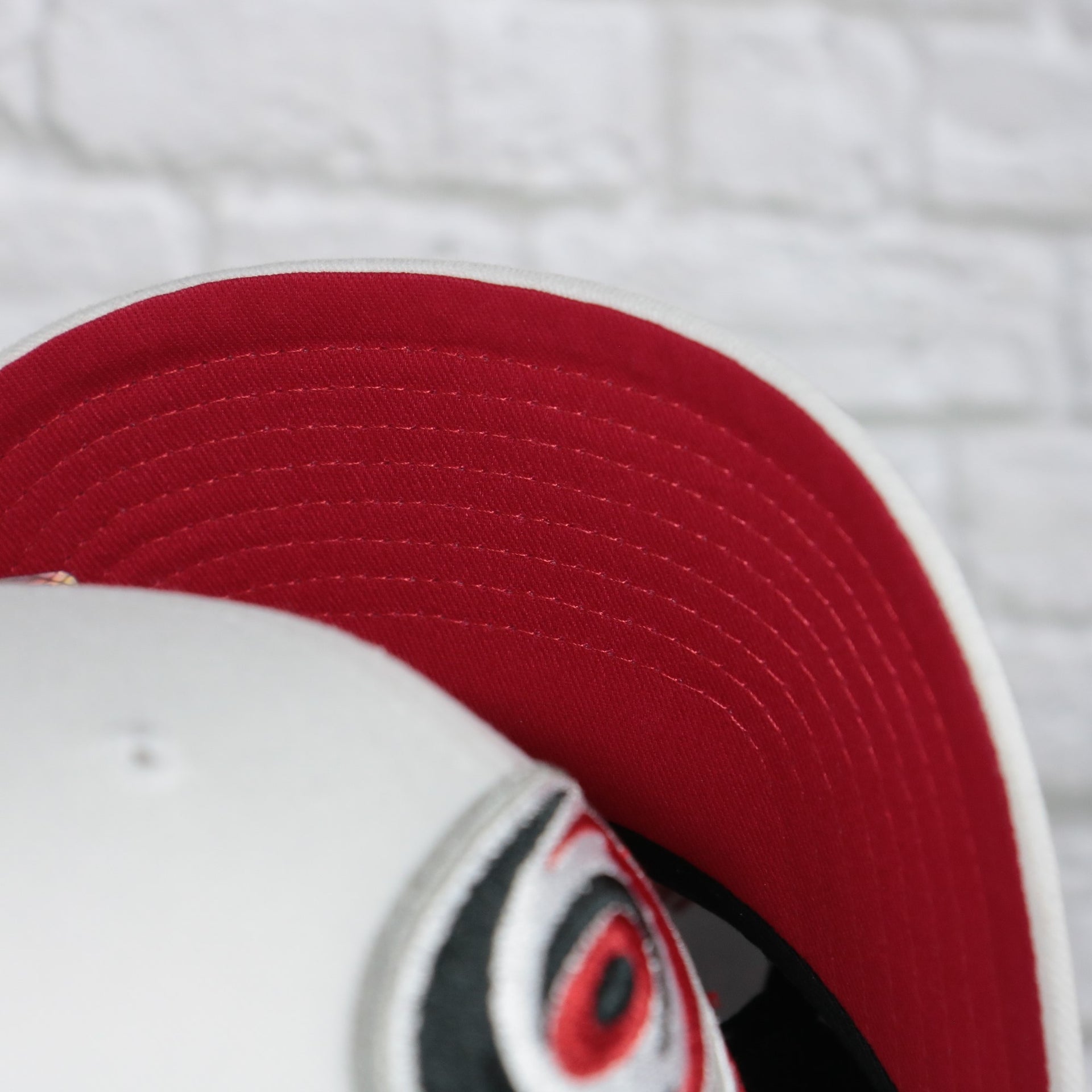 red under visor on the Carolina Hurricanes NHL All in Pro Red Bottom | White Snapback Hat