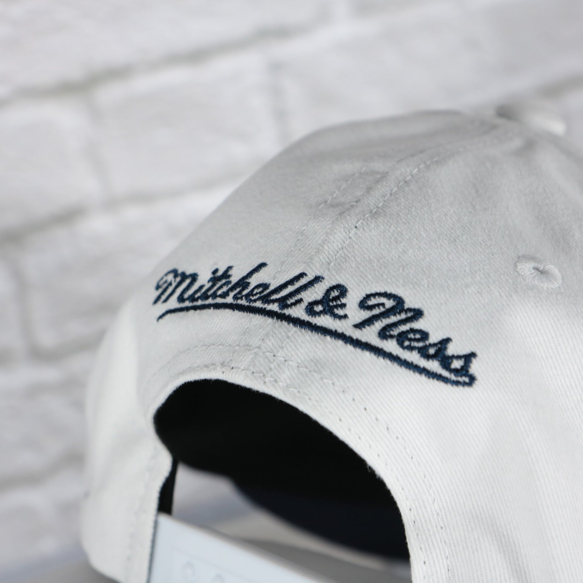 mitchell and ness logo on the Georgetown Hoyas NCAA All in Pro Navy Bottom | White Snapback Hat