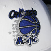 magic logo on the Orlando Magic NBA Hardwood Classics All in Pro Navy Blue Bottom | White Snapback Hat