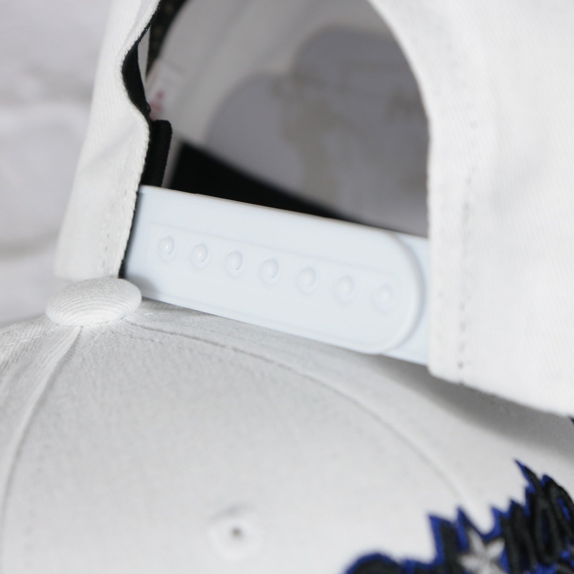 white adjustable snap on the Orlando Magic NBA Hardwood Classics All in Pro Navy Blue Bottom | White Snapback Hat
