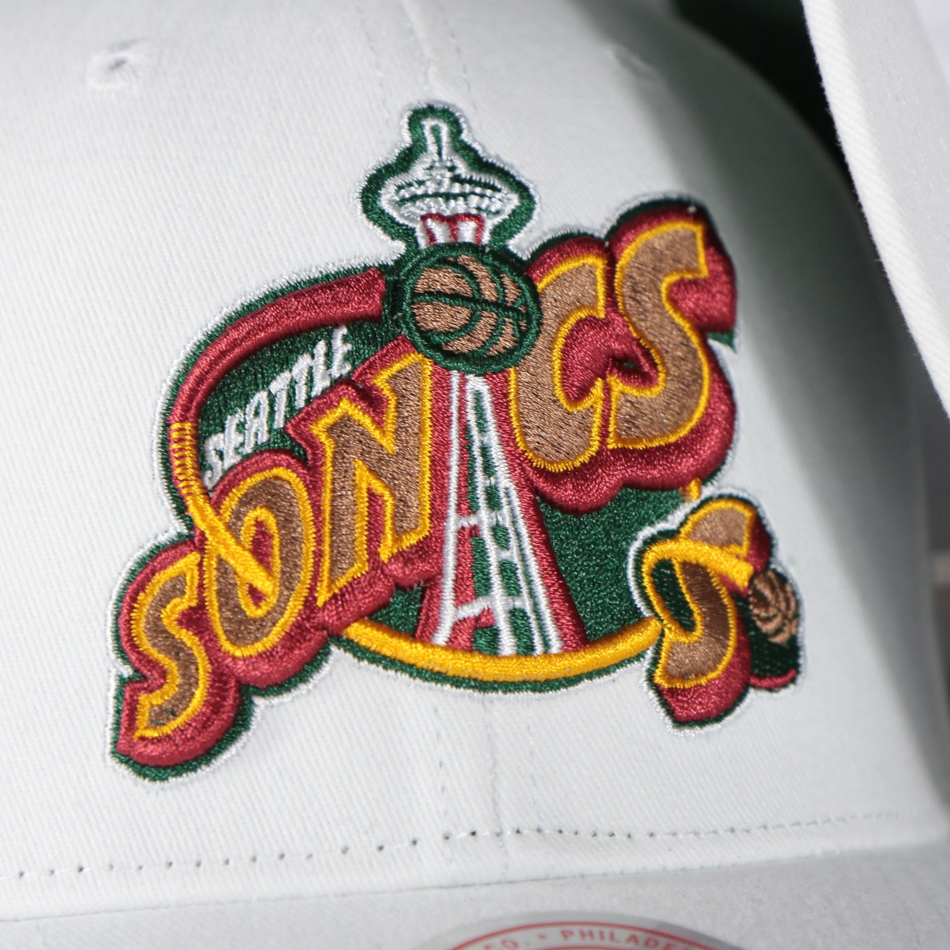 sonics logo on the Seattle Supersonics NBA Hardwood Classics All in Pro Green Bottom | White Snapback Hat