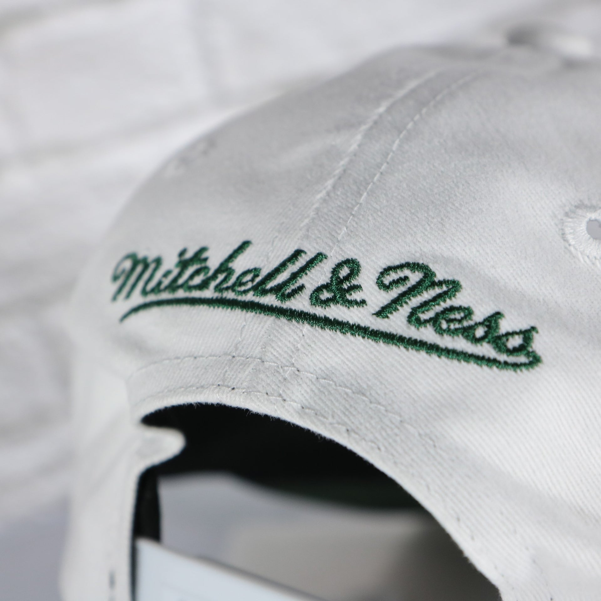 mitchell and ness logo on the Seattle Supersonics NBA Hardwood Classics All in Pro Green Bottom | White Snapback Hat