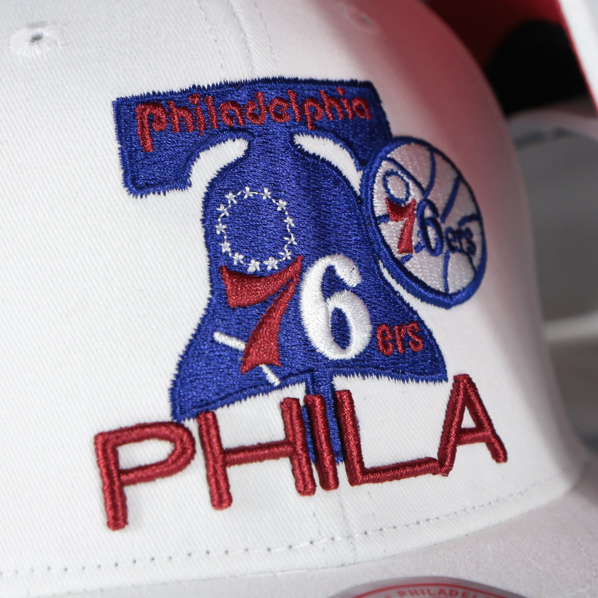 76ers logo on the Philadelphia 76ers NBA Hardwood Classics All in Pro Red Bottom | White Snapback Hat