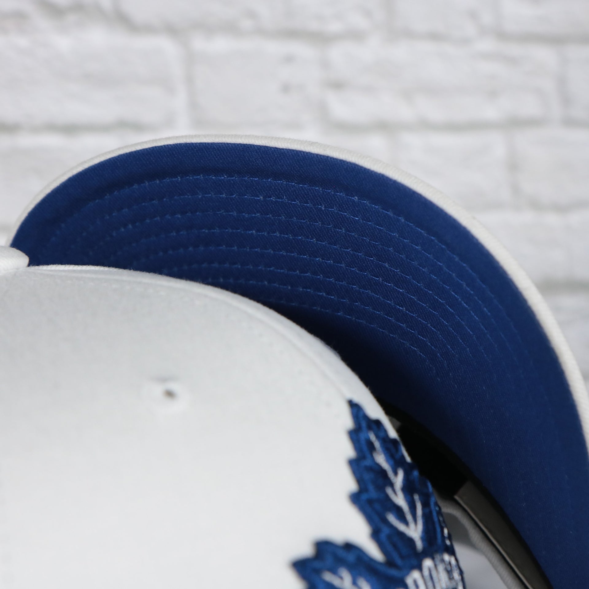 blue undervisor on the Toronto Maple Leafs NHL All in Pro Blue Bottom | White Snapback Hat