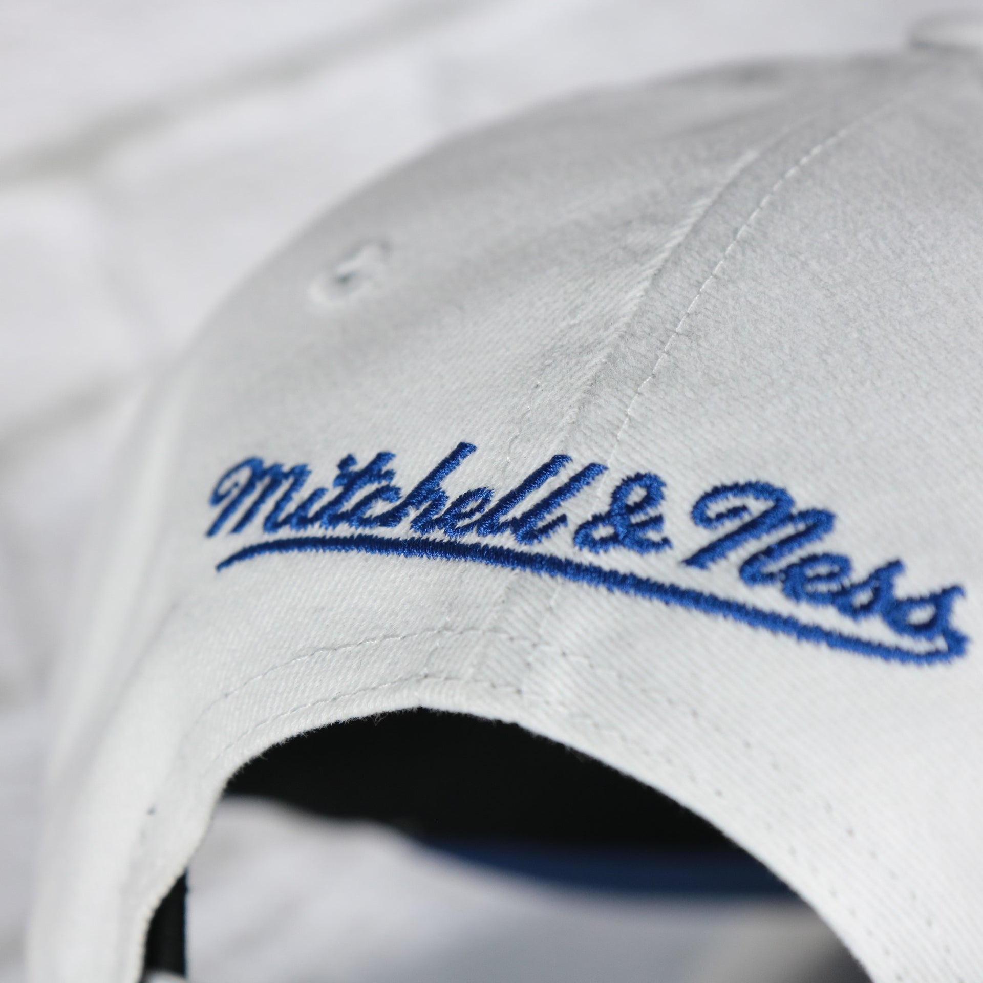 mitchell and ness logo on the St. Louis Blues NHL All in Pro Blue Bottom | White Snapback Hat
