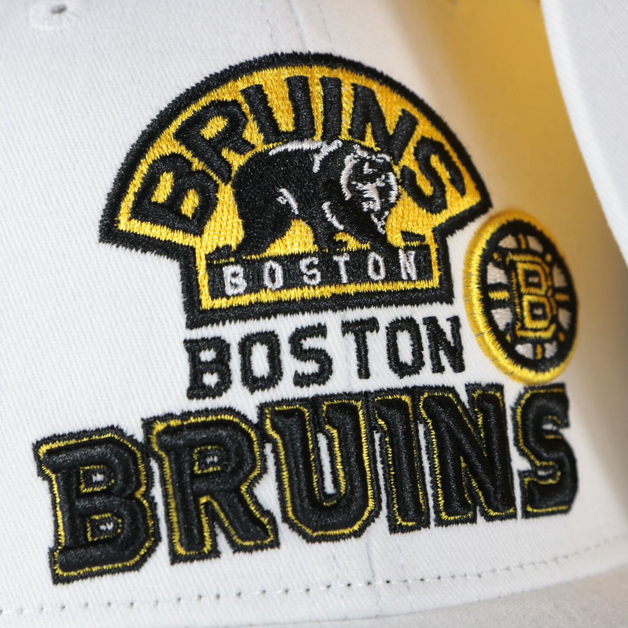 bruins logo on the Boston Bruins NHL All in Pro Yellow Bottom | White Snapback Hat