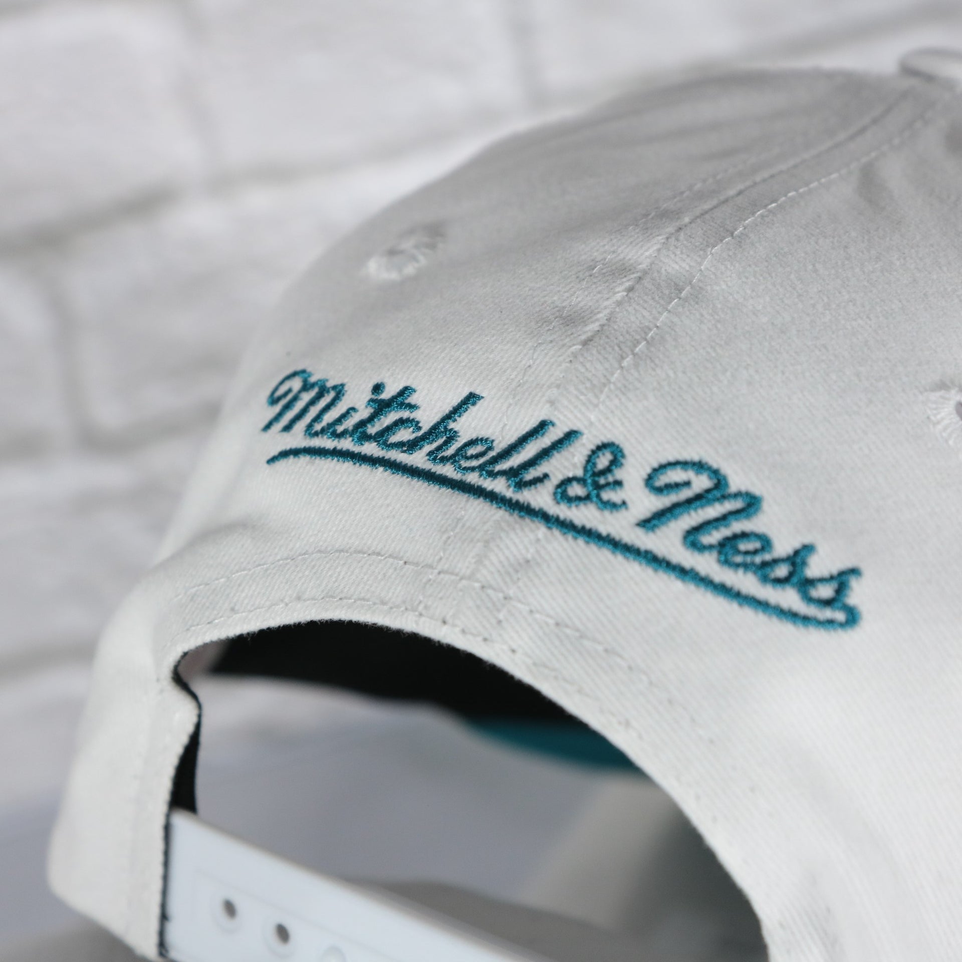 mitchell and ness logo on the San Jose Sharks NHL All in Pro Teal Bottom | White Snapback Hat