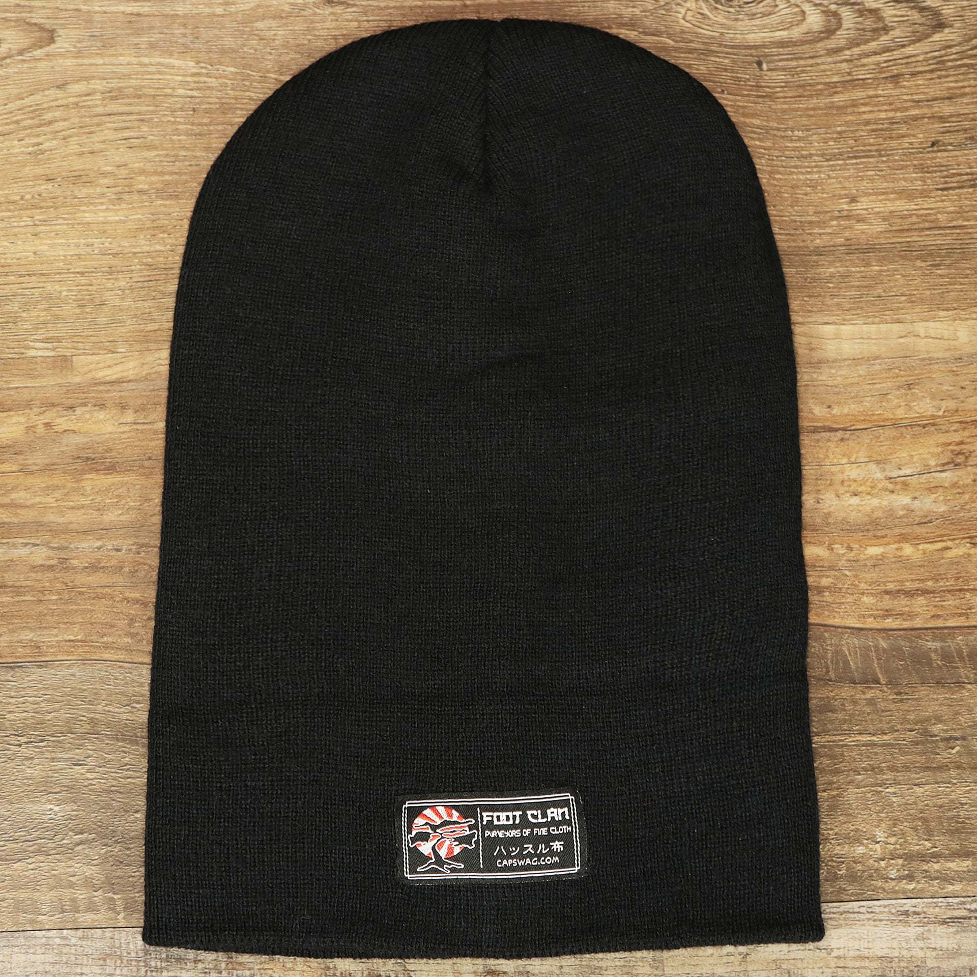 The backside of the Classic Black Winter Knit Cuffed Beanie uncuffed