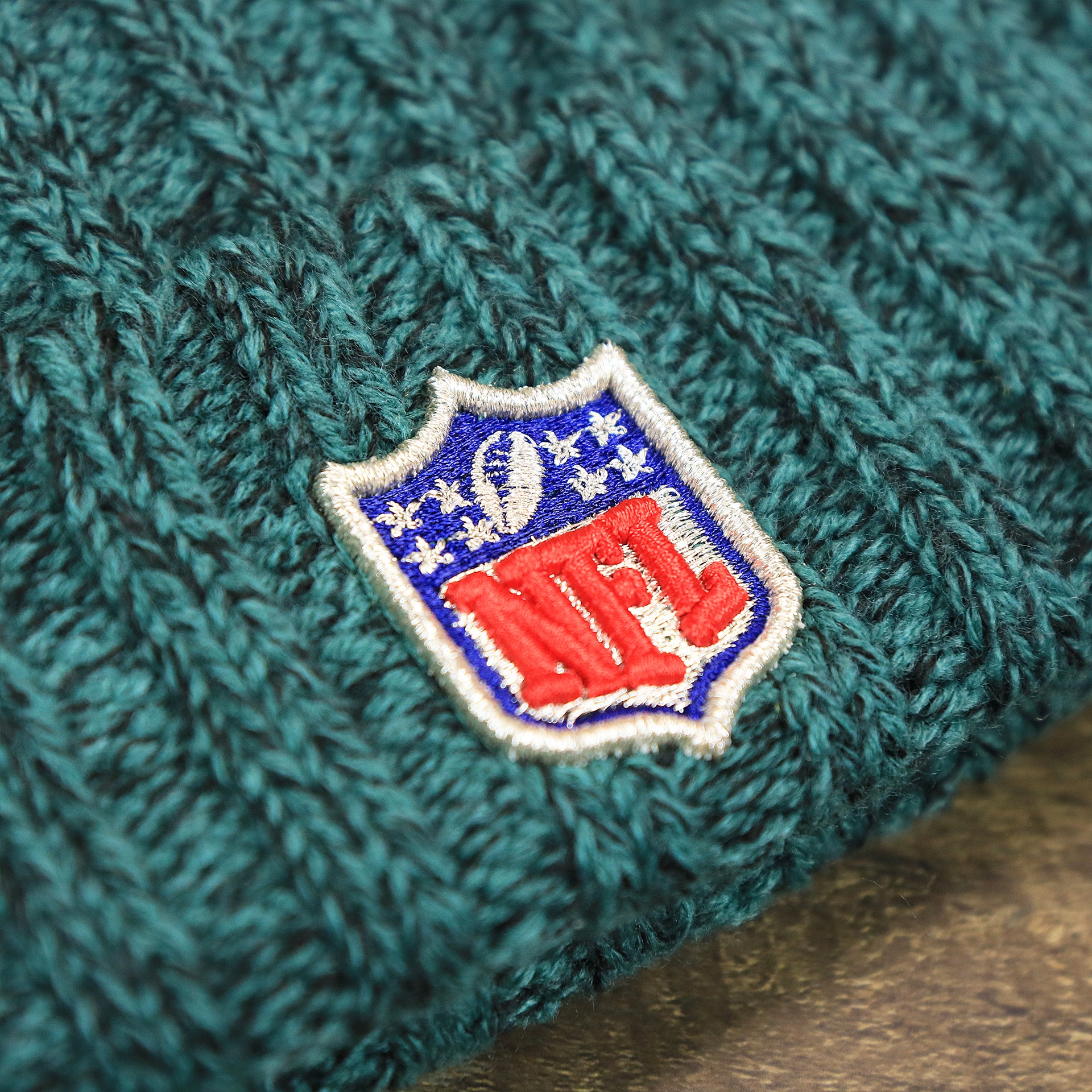 The NFL Logo on the Women’s Philadelphia Eagles Midnight Green On Field Knit Winter Beanie | Green Winter Beanie