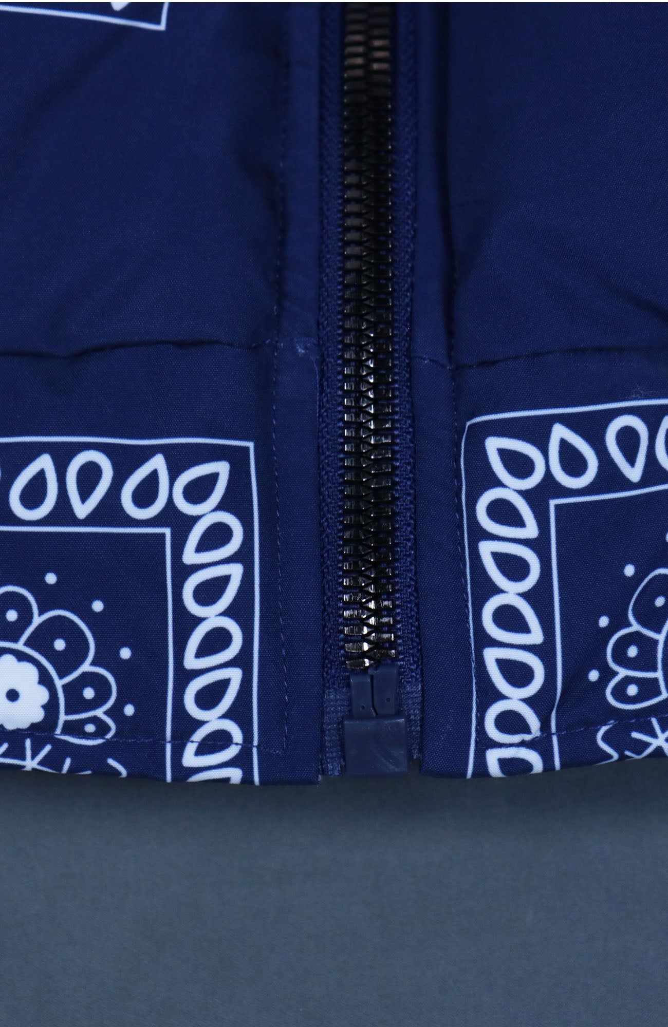 bottom of the zipper Navy Bandanna Print Jacket | Classic Paisley Pattern Winter Jacket | Faux Vegan Fur Hood