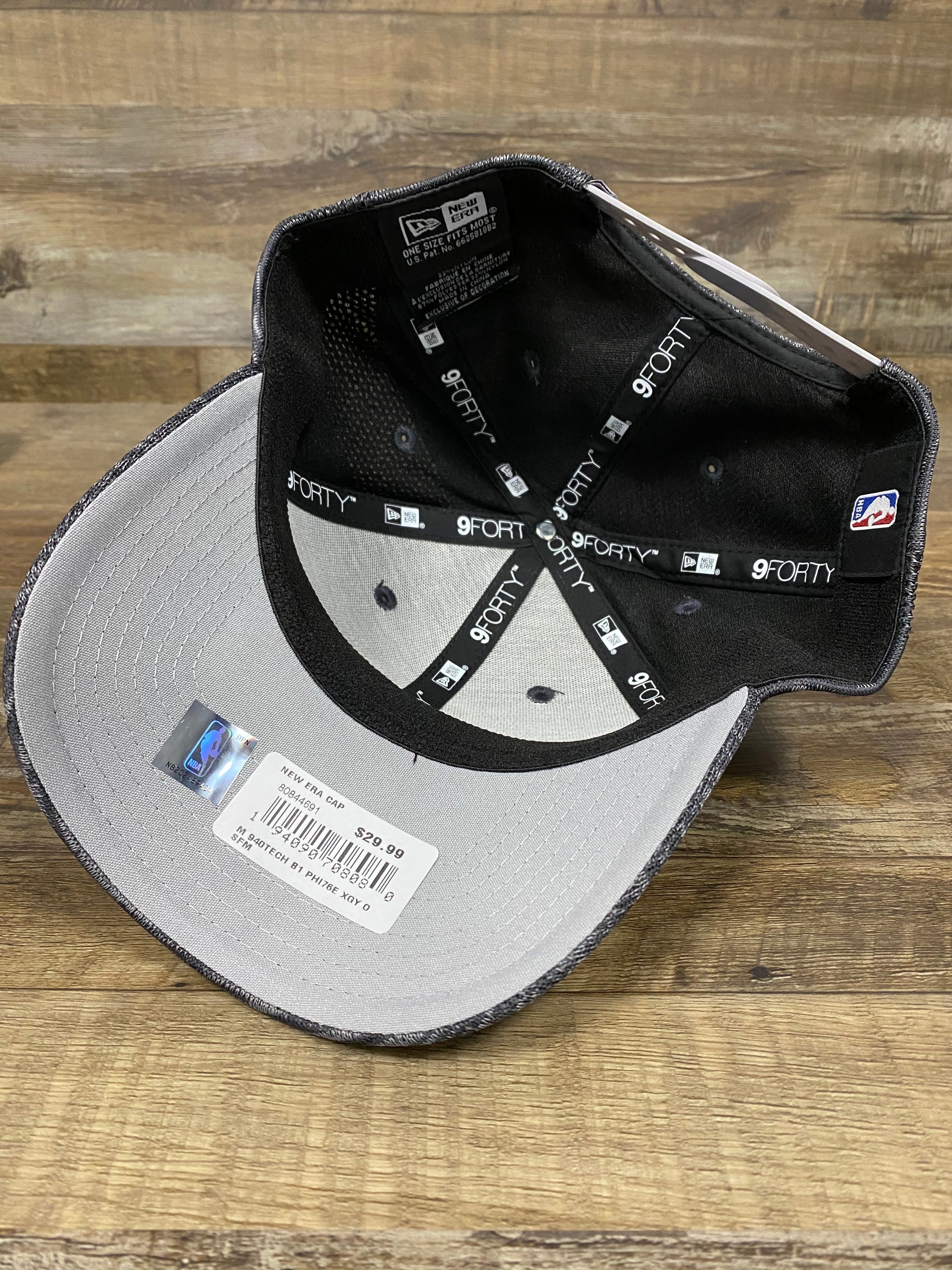 on the bottom of the Philadelphia 76ers Flyknit Look Space Dye Gray Trucker Dad Hat is a gray underbrim