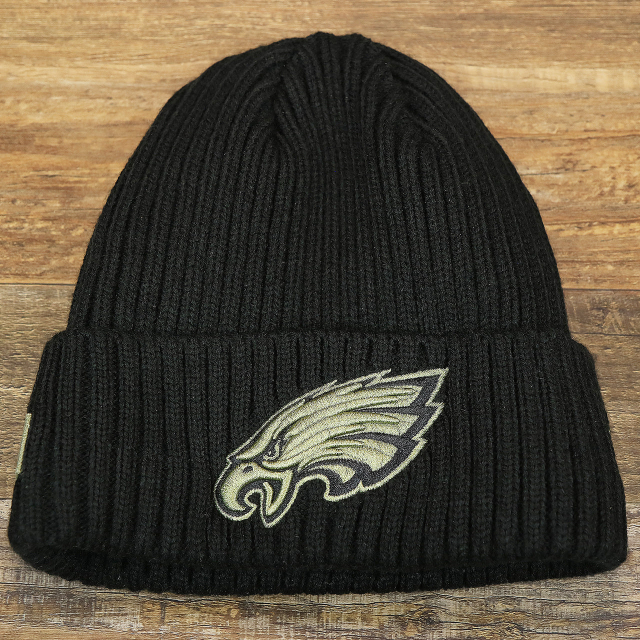 The front of the Philadelphia Eagles Salute To Service On Field Cuffed Winter Beanie | Black Winter Beanie