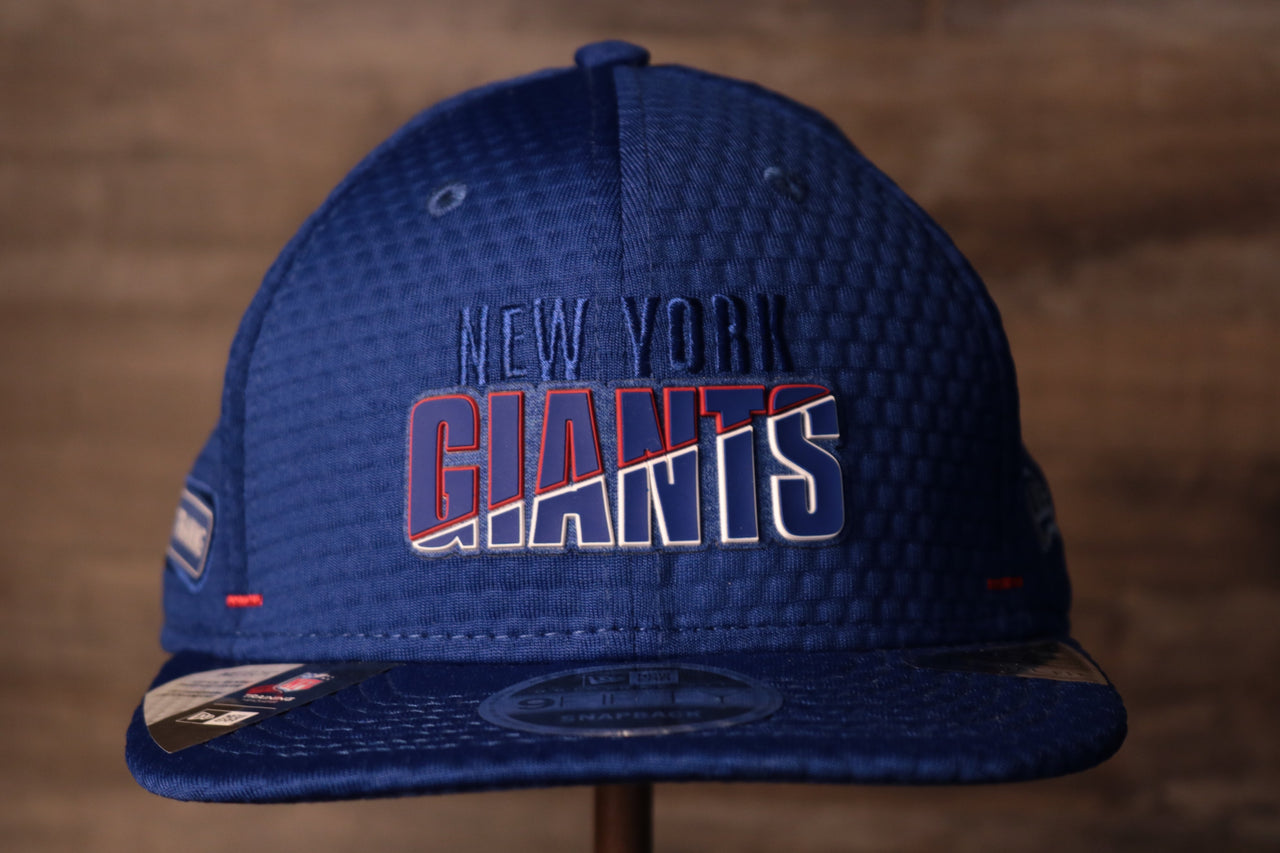 Giants 2020 Training Camp Snapback Hat | New York Giants 2020 On-Field Red Training Camp Snap Cap the front of this cap has the giant logo and the city name