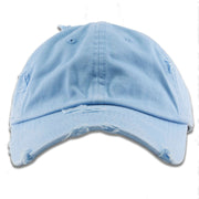 The light blue blank distressed dad hat has a light blue unstructured crown and a bent brim