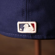 The MLB Batterman Logo on the Philadelphia Phillies Blue on Red Game Authentic 59Fifty Fitted Cap