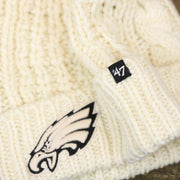 The 47 Brand Tag on the Women’s Philadelphia Eagles Cuffed Winter Knit Beanie With Meeko Pom Pom | Women’s Cream Winter Beanie