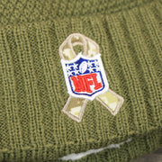The Salute To Service Ribbon on the Women’s Dallas Cowboys Salute To Service Ribbon Rubber Military Cowboys Patch On Field NFL Beanie | Women’s Military Green Beanie