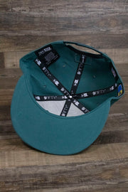 the Philadelphia Eagles NFL Draft 2019 Snapback Hat | Philly Eagles Midnight Green 9Fifty Snapback Draft Hat has a midnight green underbrim