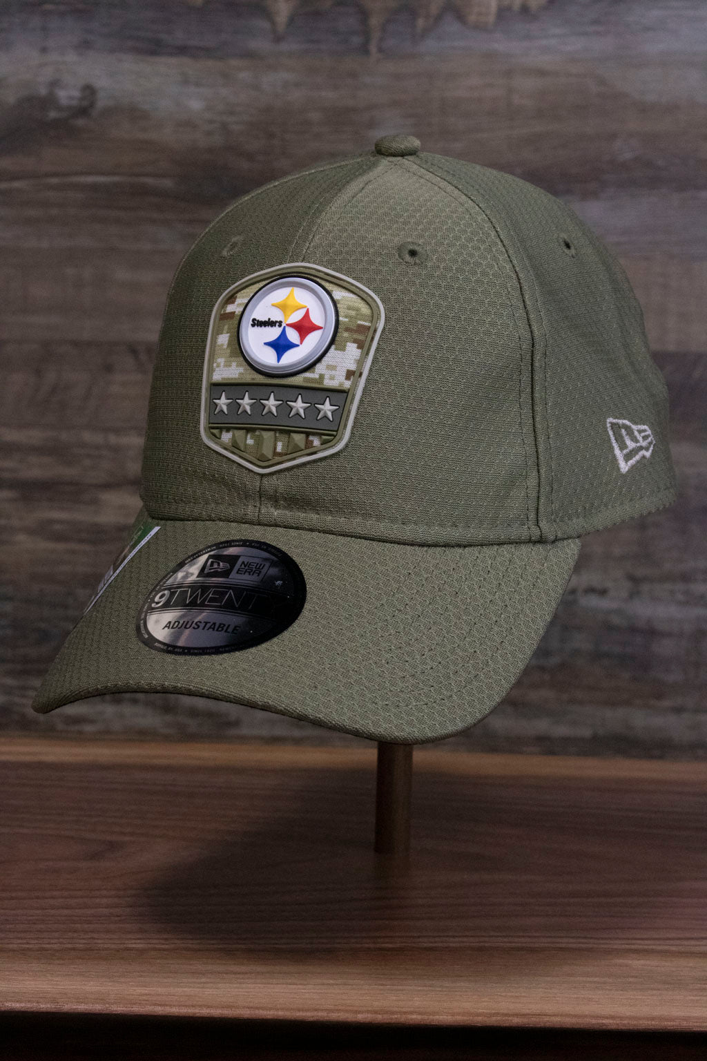 the front of the Pittsburgh Steelers 2019 Salute To Service Dad Hat | Steelers On Field Olive Green Military Inspired Baseball Cap