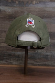 the back of the Pittsburgh Steelers 2019 Salute To Service Dad Hat | Steelers On Field Olive Green Military Inspired Baseball Cap has a large NFL shield and ribbon, plus an adjustable strap