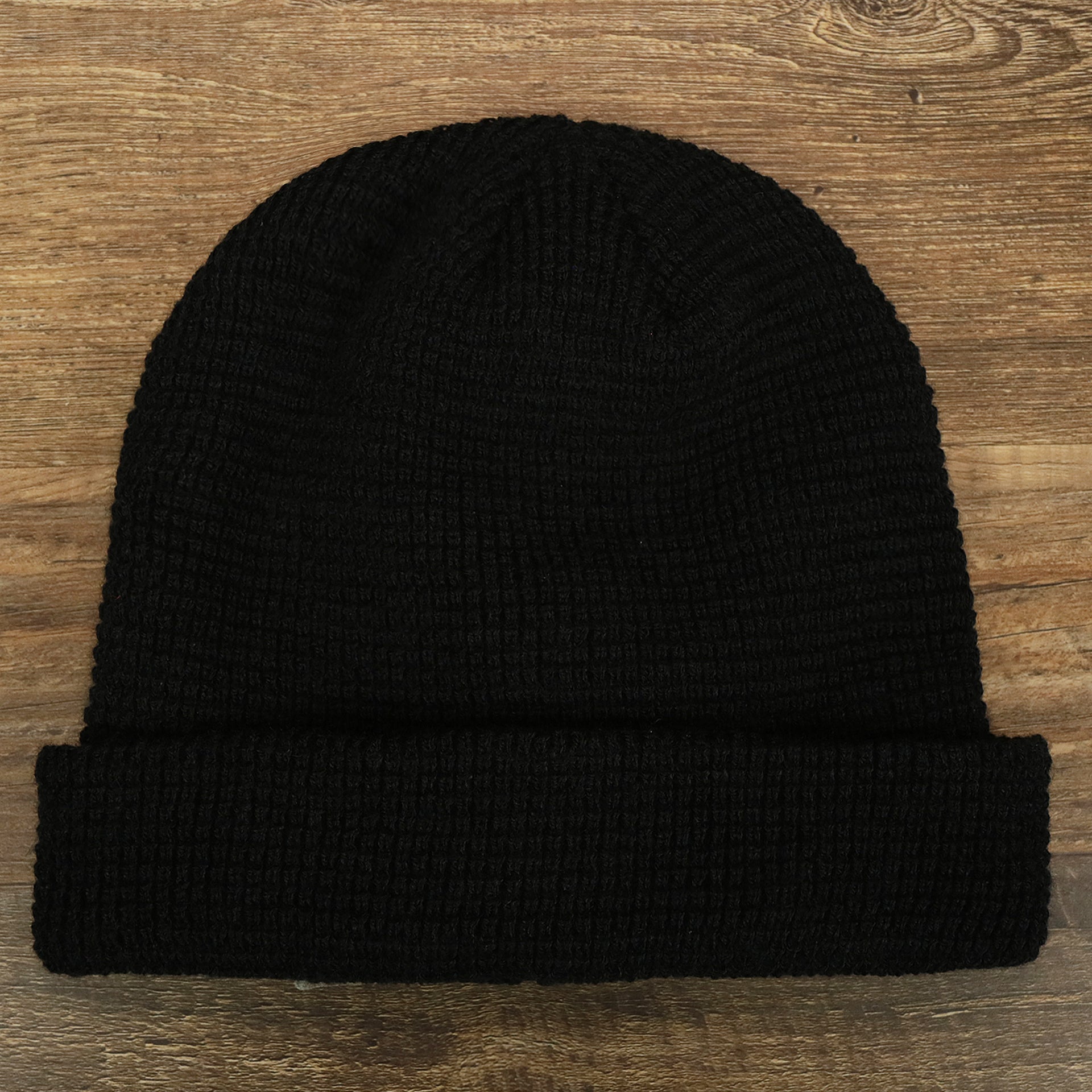 The front of the Black Fisherman Knit Cuffed Beanie