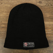 The Foot Clan Tag on the Black Fisherman Knit Cuffed Beanie