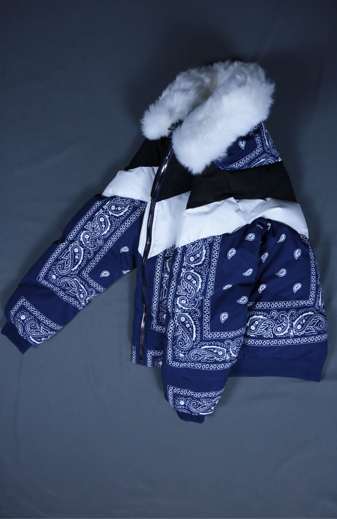 side view of the Navy Bandanna Print Jacket | Classic Paisley Pattern Winter Jacket | Faux Vegan Fur Hood