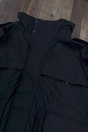 the Tactical Shell Jacket with Stow-Away Hood | Black Scotchlite Tacshell Jacket has a high collar