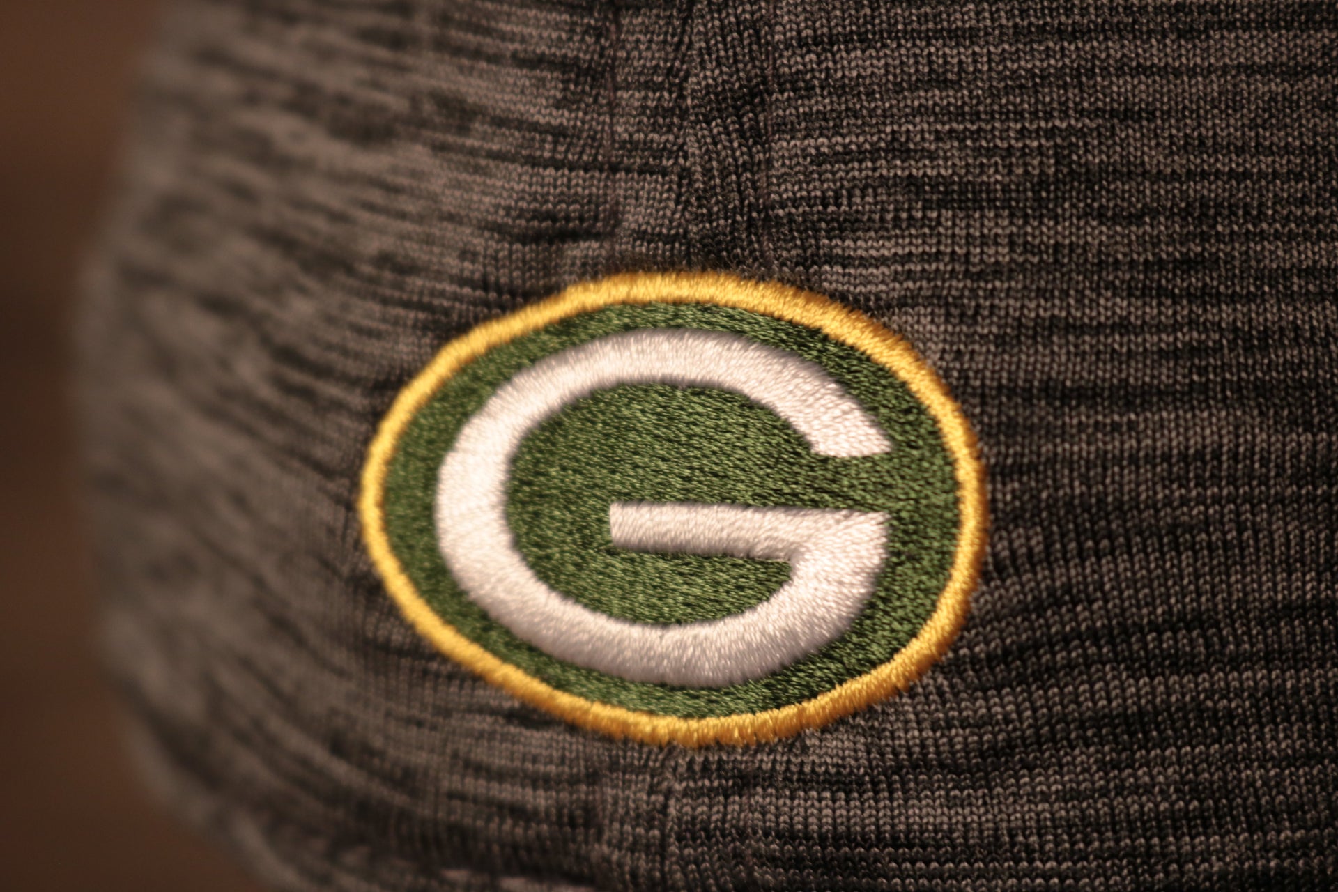 Packers 2020 Training Camp Flexfit | Green Bay Packers 2020 On-Field Grey Training Camp Stretch Fit  the packers logo is on the back of this cap
