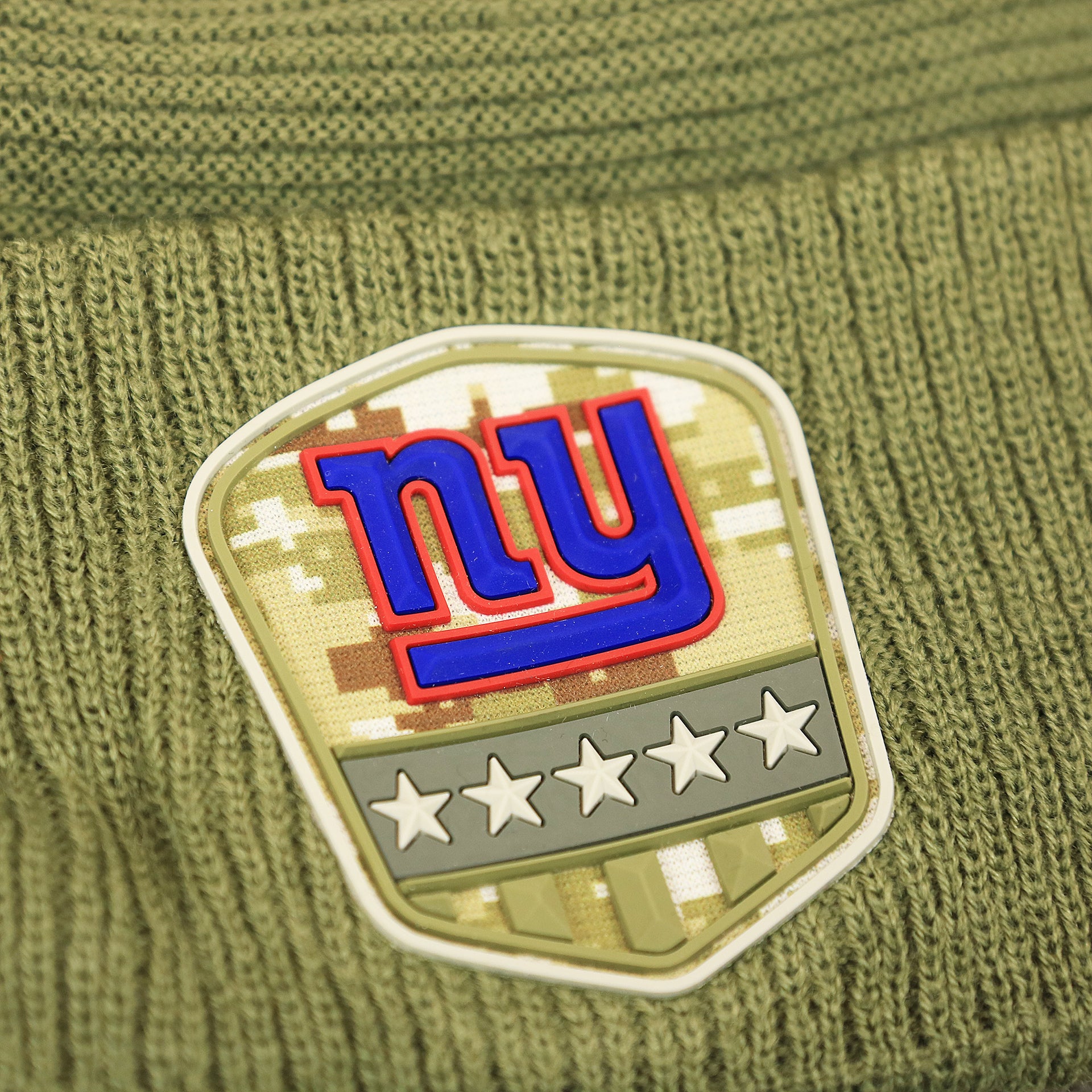 The Giants Logo on the New York Giants Salute To Service Ribbon Rubber Military Giants Patch On Field NFL Beanie | Military Green Beanie