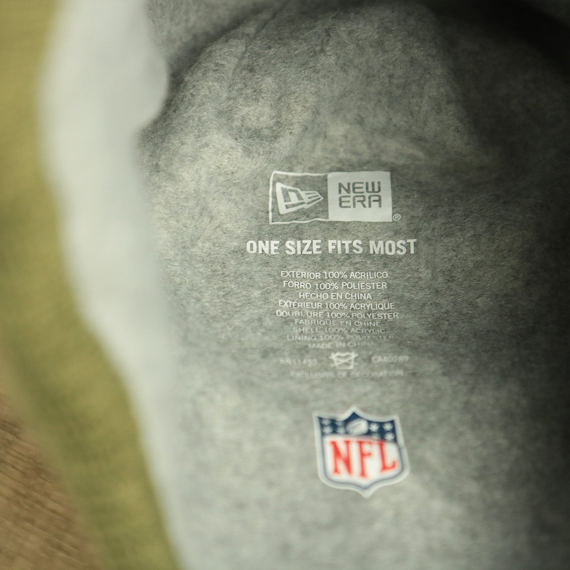 The Tags on the Dallas Cowboys Salute To Service Ribbon Rubber Military Cowboys Patch On Field NFL Beanie | Military Green Beanie