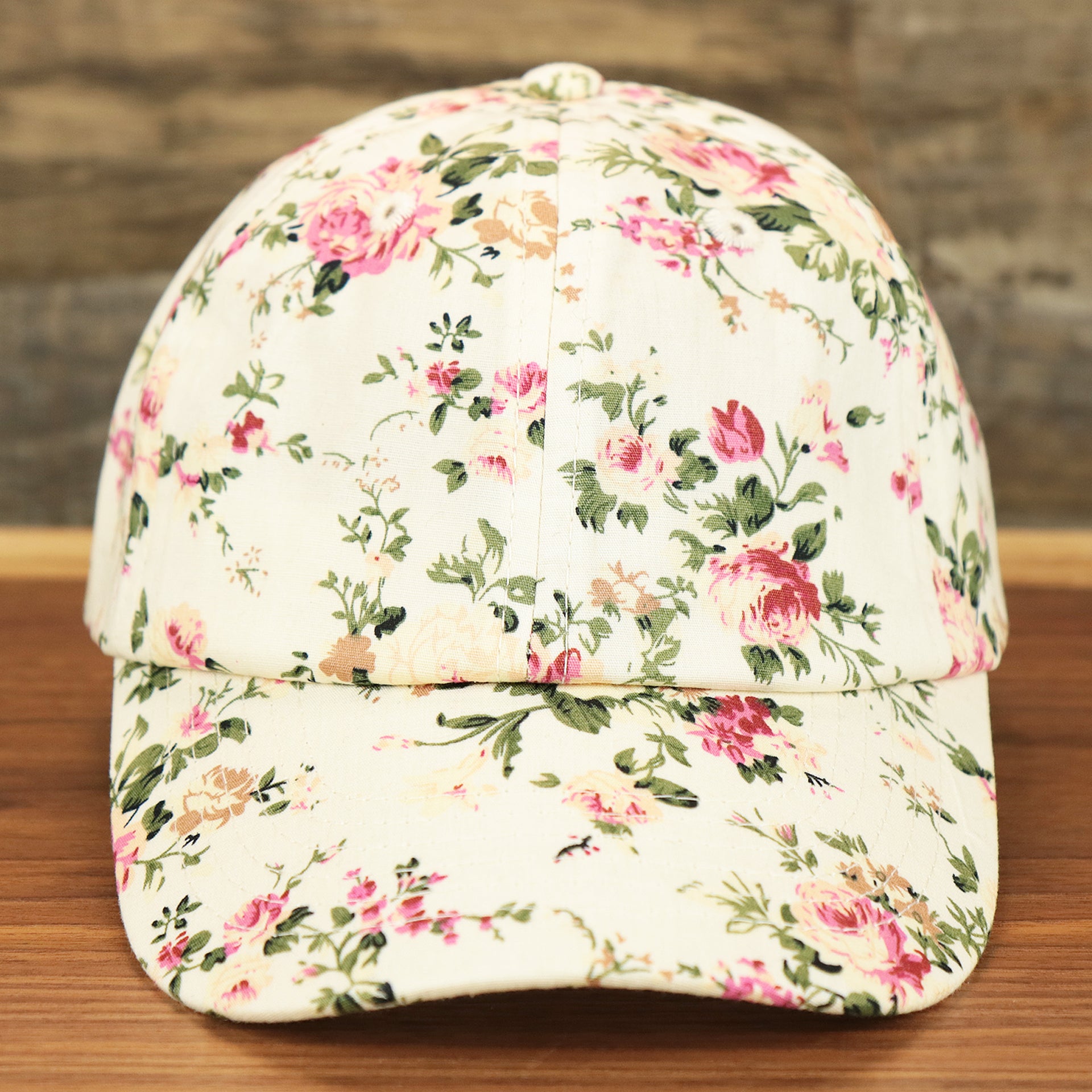 The front of the Kid’s Floral Print Blank Adjustable Baseball Hat | Youth Cream Dad Hat