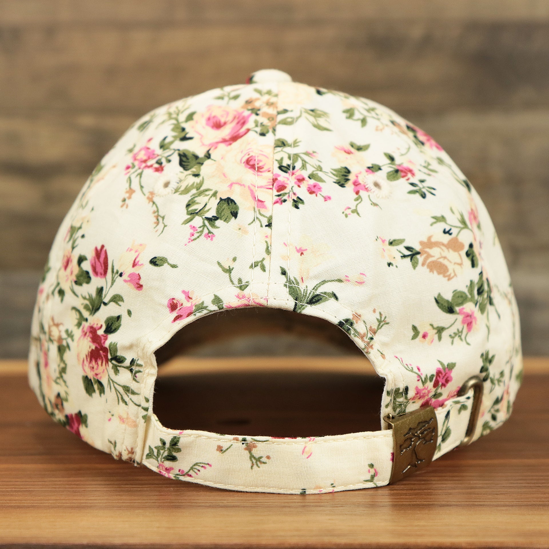 The backside of the Kid’s Floral Print Blank Adjustable Baseball Hat | Youth Cream Dad Hat