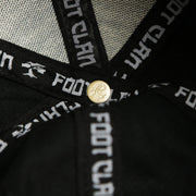 The Bonsai Tree Engraved Button on the Jet Black Structured Cotton Blank Small Fit Flexfit Cap | Black Stretch Fit Caps