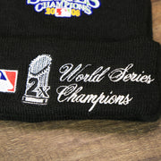 The World Series 2x Champions Graphic  on the Philadelphia Phillies All Over World Series Side Patch 2x Champion Knit Cuff Beanie | New Era, Black
