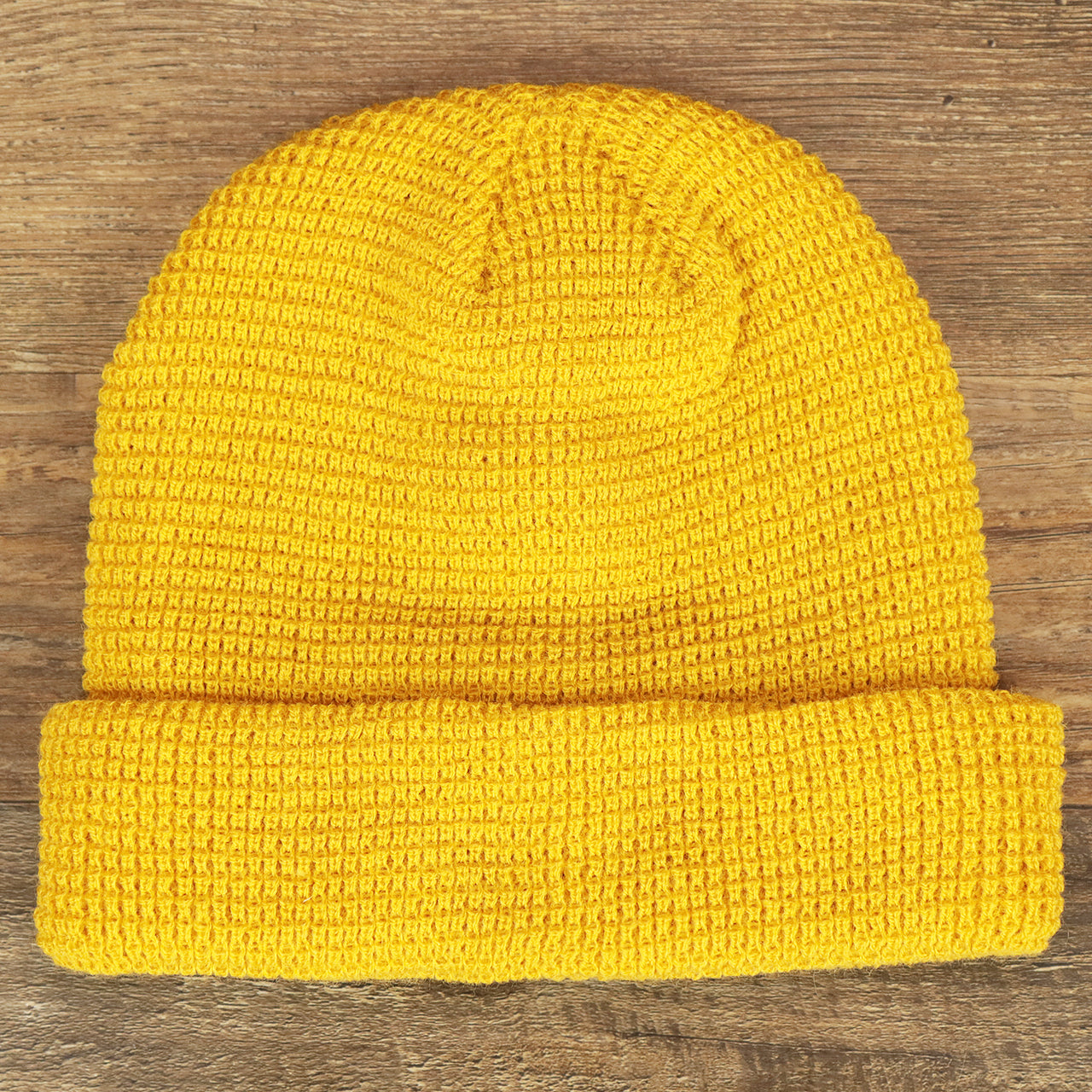 The front of the Mustard Golden Yellow Fisherman Knit Cuffed Beanie