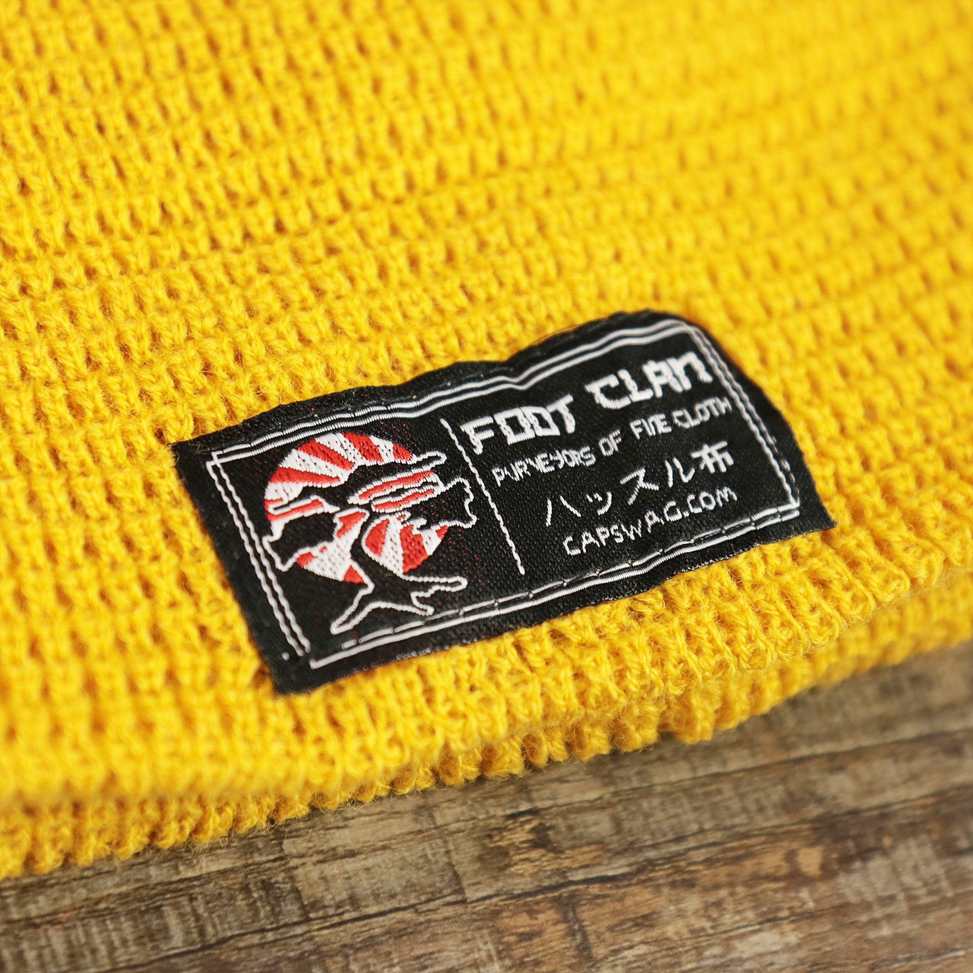 The Foot Clan Tag on the Mustard Golden Yellow Fisherman Knit Cuffed Beanie