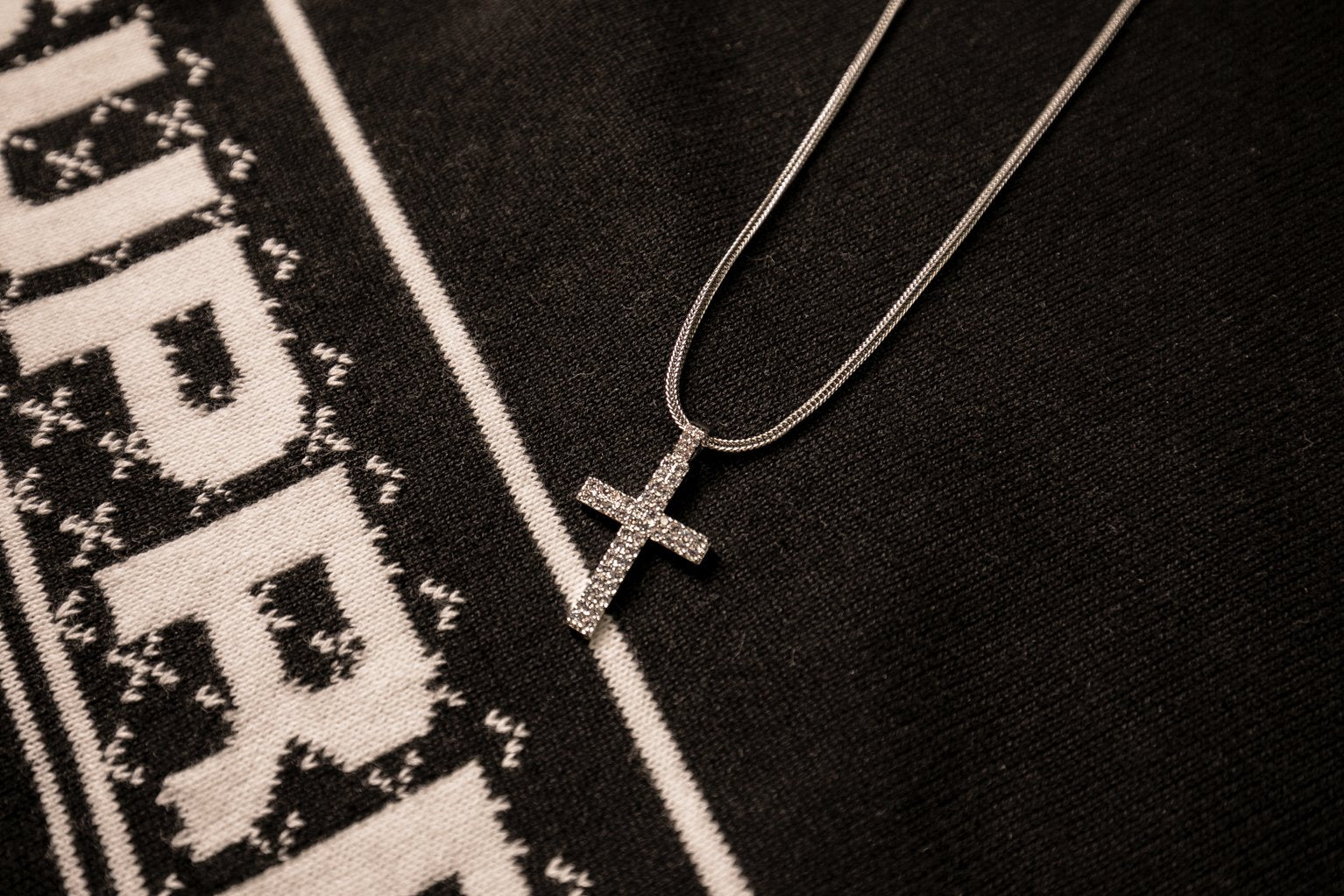 The Iced Out Stainless Steel Silver Double Row Cross Pendant | Golden Gilt laid out 