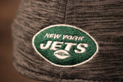 The jets logo is on the back Jets 2020 Training Camp Flexfit | New York Jets 2020 On-Field Grey Training Camp Stretch Fit