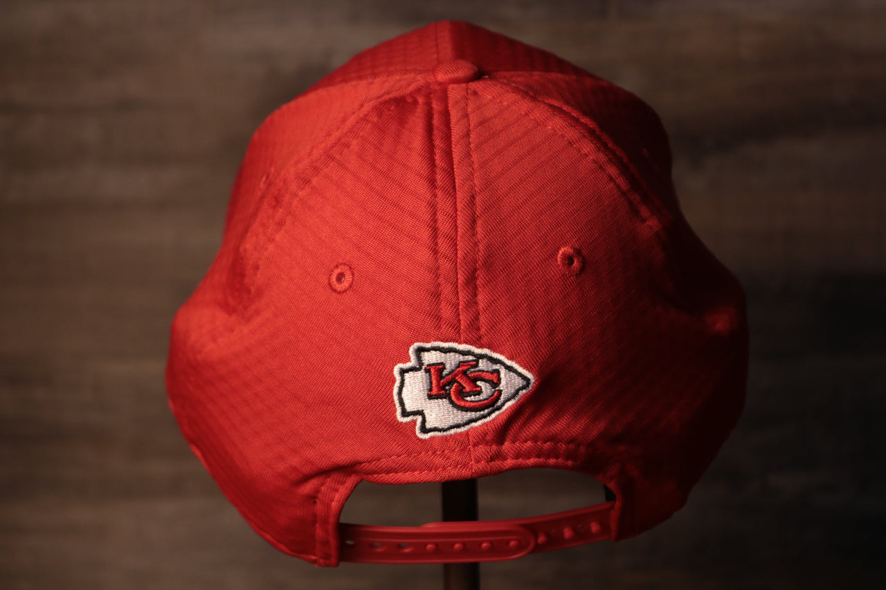 The backside of this chiefs hat has the logo above the snap Chiefs 2020 Training Camp Snapback Hat | Kansas City Chiefs 2020 On-Field Red Training Camp Snap Cap