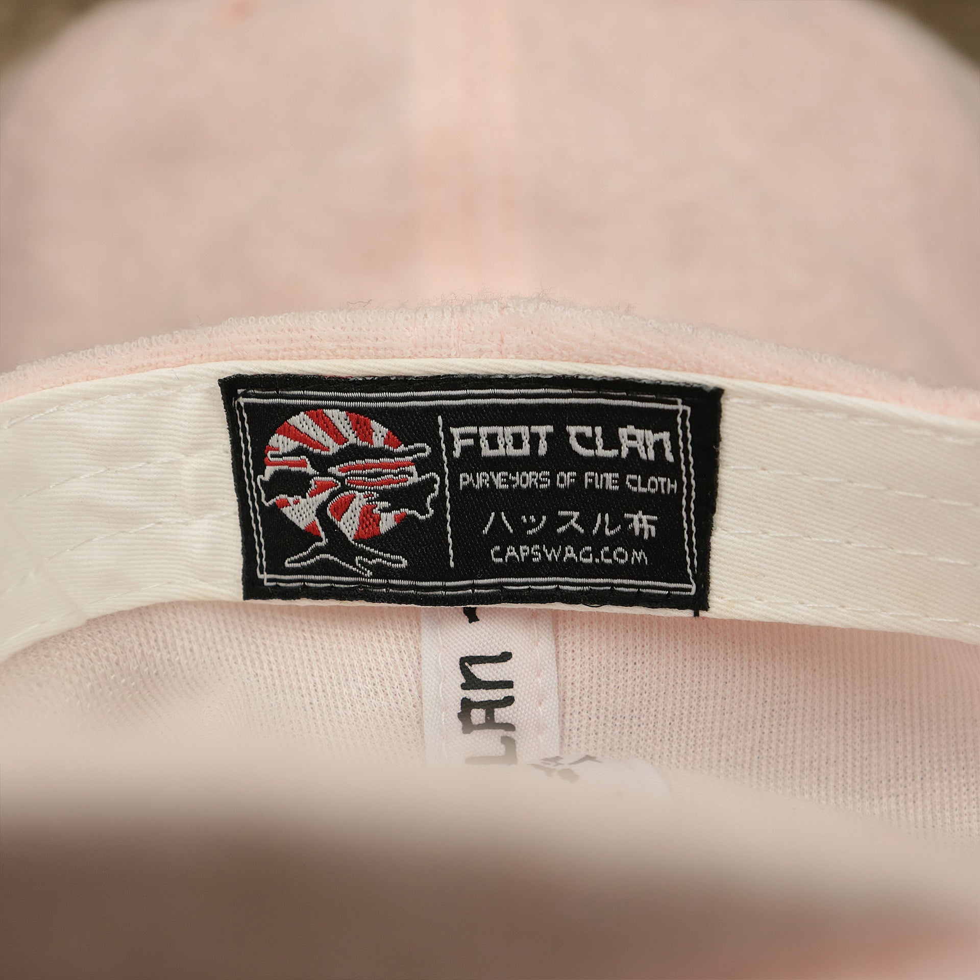 The Foot Clan Tag on the Blank Misty Rose Wash Cloth Baseball Hat | Light Pink Dad Hat