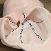 The inside of the Blank Misty Rose Wash Cloth Baseball Hat | Light Pink Dad Hat