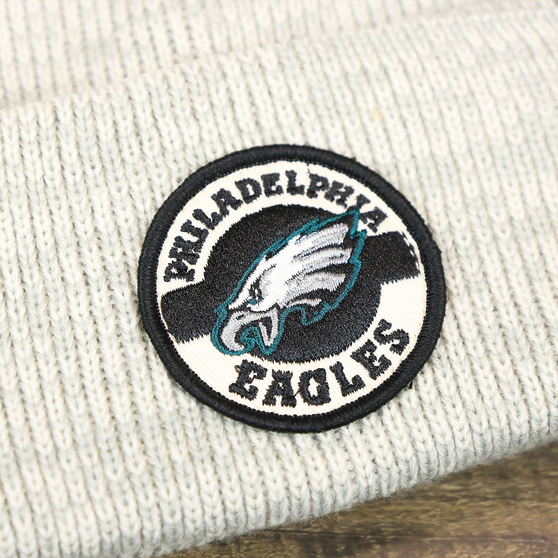The Eagles Patch on the Philadelphia Eagles Patch Cuffed Winter Beanie | Heather Gray Winter Beanie