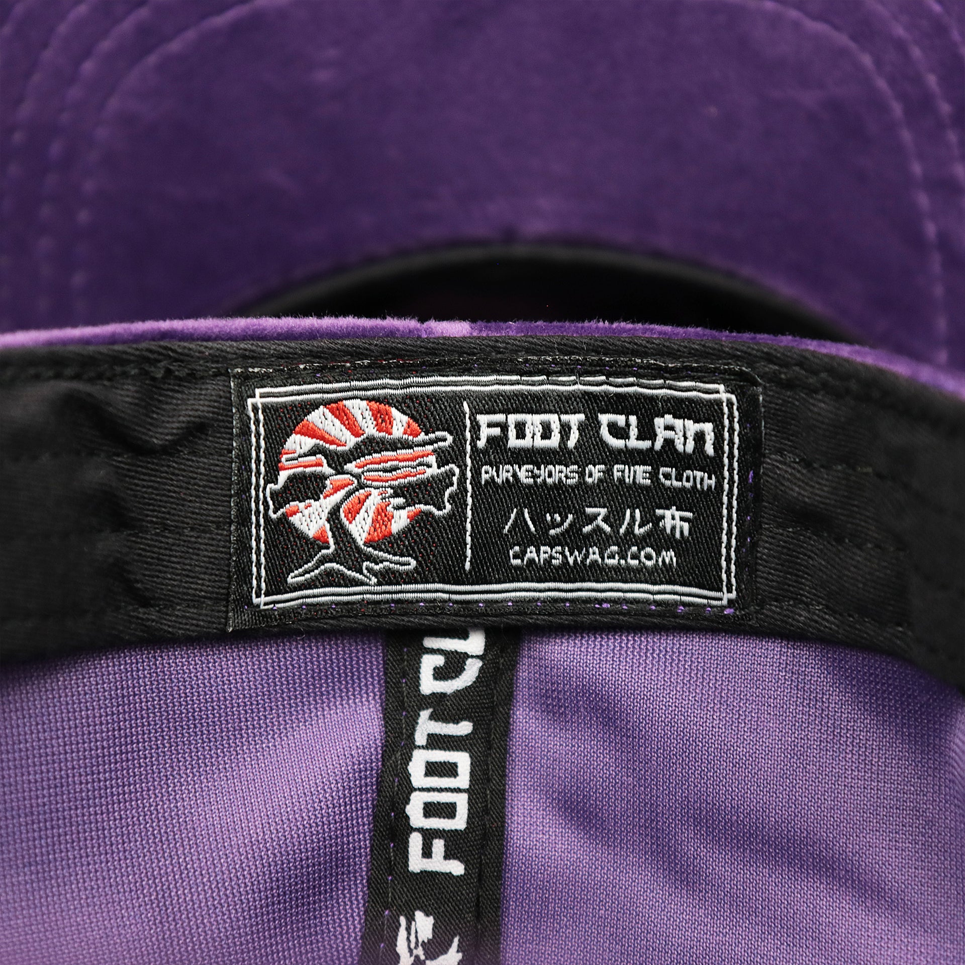 The Foot Clan Tag on the Velour Blank Concord Grape Snapback Cap | Purple Snap Cap